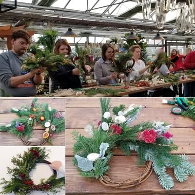 People making wreaths in a greenhouse.
